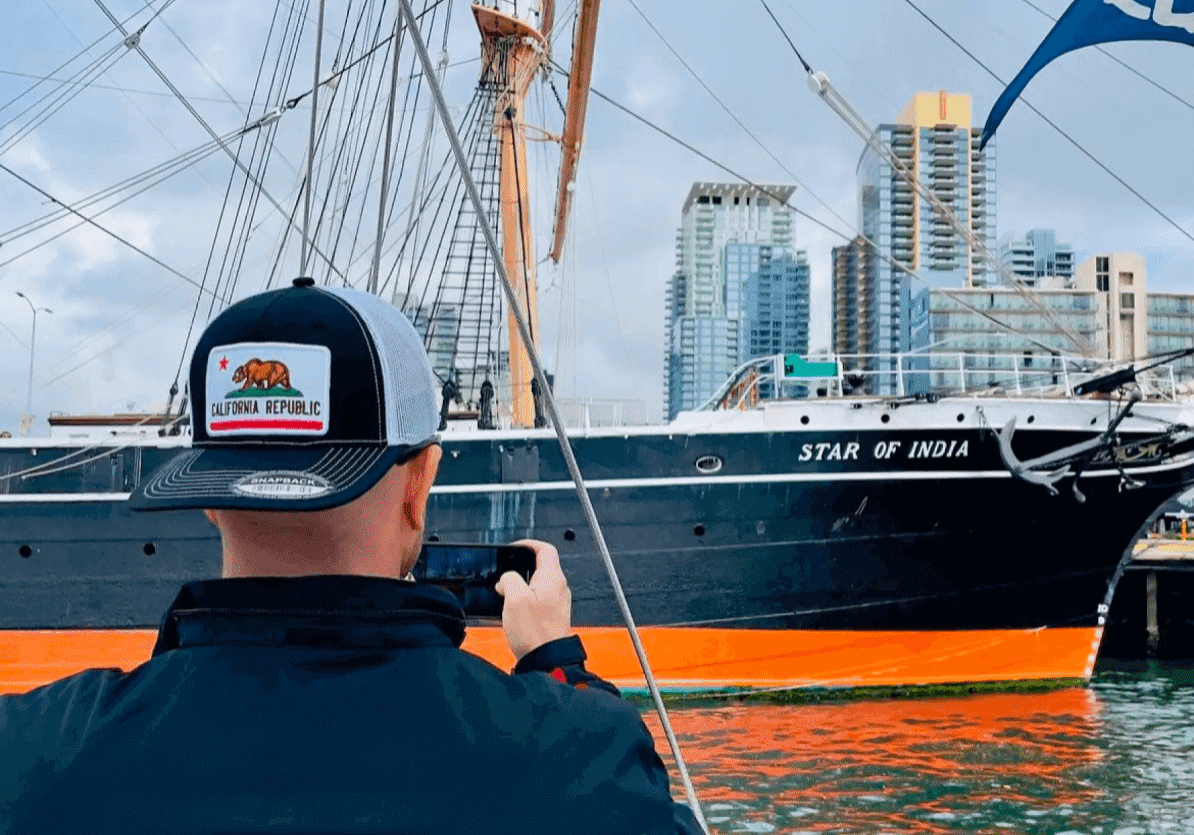 Person photographing Star of India ship.