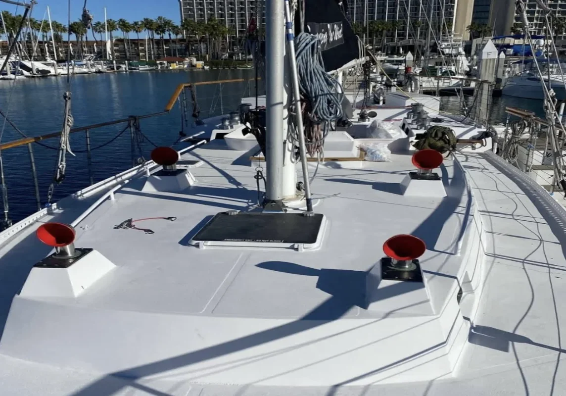 Boat deck leading to mast at sunny marina